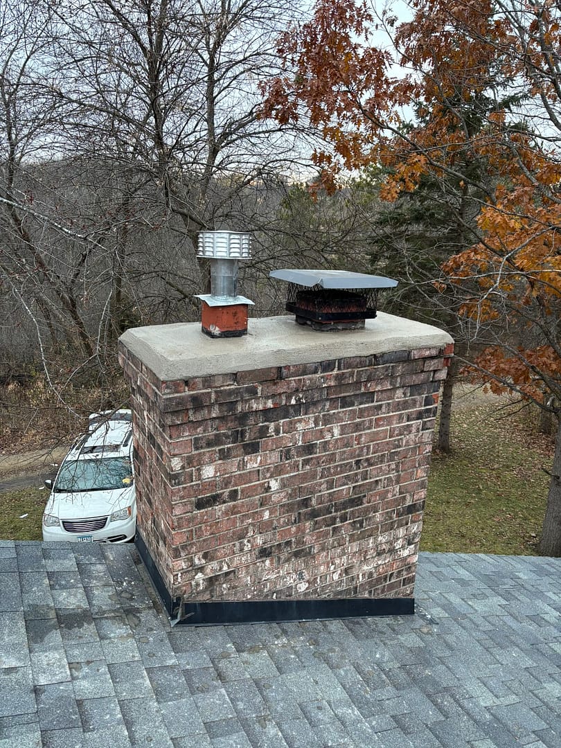 Chimney Cleaning in Minnetonka MN – Technician cleaning a residential chimney with professional tools.
